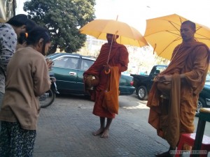 Phnom Penh - offering to monks